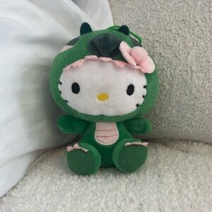 Hello kitty green dinosaur